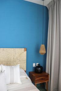 Postel nebo postele na pokoji v ubytování Hotel Boutique Gloriagave