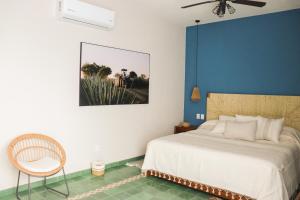 Postel nebo postele na pokoji v ubytování Hotel Boutique Gloriagave