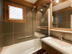 a bathroom with a shower and a tub and a sink at Appartement rénové proche station avec balcons et vue, 3 ch, 10 pers - FR-1-181-2457 in La Plagne Tarentaise +12 photos