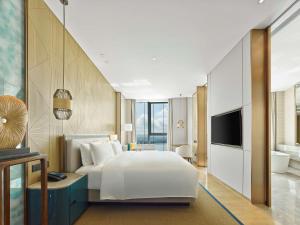 TV a/nebo společenská místnost v ubytování Hilton Hainan Ocean Flower Island