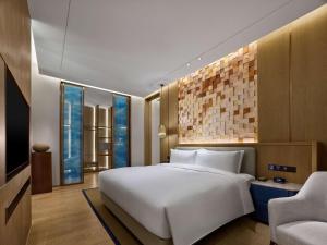 Postel nebo postele na pokoji v ubytování Hilton Hainan Ocean Flower Island