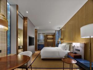 TV a/nebo společenská místnost v ubytování Hilton Hainan Ocean Flower Island