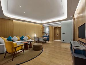 TV a/nebo společenská místnost v ubytování Hilton Hainan Ocean Flower Island