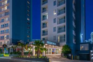 a rendering of the exterior of a hotel at night at Condado Palm Inn San Juan, Tapestry Collection by Hilton in San Juan