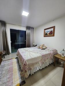 מיטה או מיטות בחדר ב-Casa em São Lourenço-MG