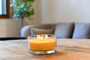 a candle in a glass on a table at Hotel Celta in Vigo