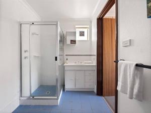 a bathroom with a shower and a sink at Whale Watch Augusta Family Retreat in Augusta +24 photos