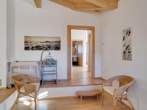 a living room with chairs and a table at Chalet Pinzgau in Neukirchen am Großvenediger