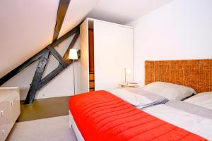 Postel nebo postele na pokoji v ubytování HAUS DOHRMANN - mit direktem Strandzugang,moderne, ruhig gelegene Ferienwohnungen mit Terrasse