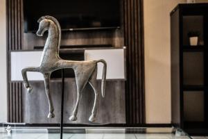 a statue of a giraffe sitting on a chair at Banbury Estate luxury apartment in Johannesburg