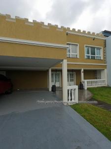 a house with a driveway in front of it at Mar Del Castle in Mar del Plata