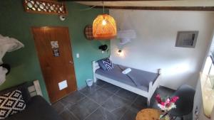 Postel nebo postele na pokoji v ubytování Finca Hostal Bolivar - Casa Mango