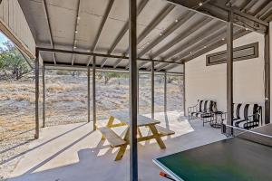 a room with a ping pong table and a pool table at Stella Vista in Dripping Springs