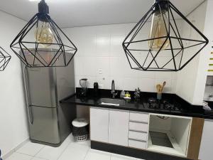Een keuken of kitchenette bij Bexp Spaces | Aruanã Alphaville