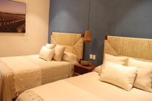 Postel nebo postele na pokoji v ubytování Hotel Boutique Gloriagave