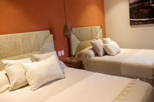 Postel nebo postele na pokoji v ubytování Hotel Boutique Gloriagave