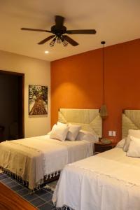 Postel nebo postele na pokoji v ubytování Hotel Boutique Gloriagave