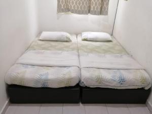 Postel nebo postele na pokoji v ubytování SKYHOMESTAY TELOK PANGLIMA GARANG