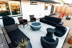 A seating area at Limitless Joshua Tree : Modern Home w/ Cowboy Pool