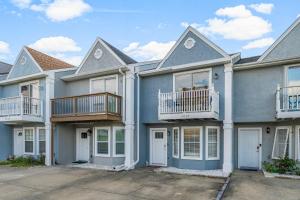 a row of houses with balconies on them at Barefoot Bungalow in Panama City Beach