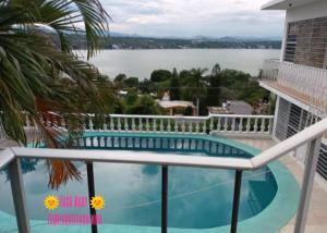 a view of a swimming pool on the balcony of a house at CASA MARY in Tequesquitengo