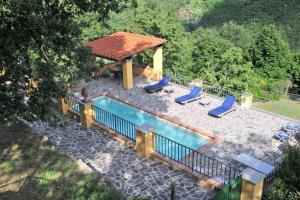 an overhead view of a swimming pool with a gazebo at Holiday home in Vicchio - Toskana 27442 in Vicchio