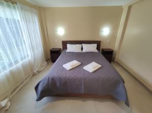 Postel nebo postele na pokoji v ubytování Apartamento "Tungurahua View"