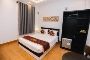 מיטה או מיטות בחדר ב-Thinh Gia Phat Hotel Hoang Hoa Tham
