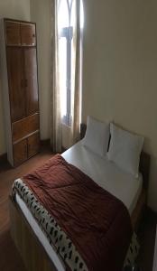 Krevet ili kreveti u jedinici u okviru objekta StayApart - Sikkim Regency