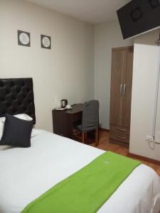 Ein Bett oder Betten in einem Zimmer der Unterkunft Runcu Arequipa
