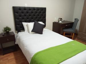 Ein Bett oder Betten in einem Zimmer der Unterkunft Runcu Arequipa