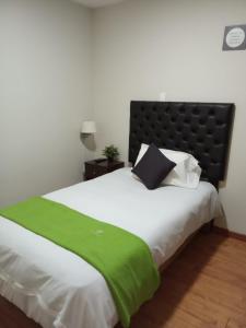 Ein Bett oder Betten in einem Zimmer der Unterkunft Runcu Arequipa