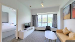 A bed or beds in a room at Grand Bay View Hotel