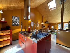 a kitchen with a sink and a counter top at Le Nid - Versegere near Verbier - 4 Valleys in Versegeres 
