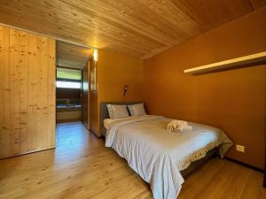 a bedroom with a large bed in a room at Le Nid - Versegere near Verbier - 4 Valleys in Versegeres 