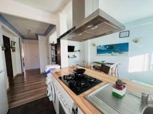 a kitchen with a stove and a counter top at ZARAGOZA CENTRAL APARTMENT in Zaragoza