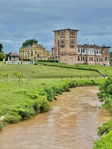 a castle with a river in front of it at Homestay Rezeki Batu Gajah in Batu Gajah
