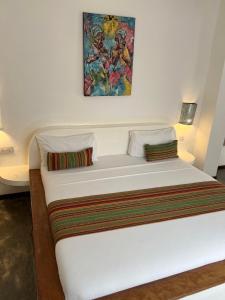 En eller flere senge i et værelse på Nungwi Getaway