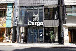a store front of a building on a city street at HOTEL Cargo Shinsaibashi in Osaka