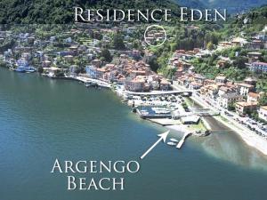 - une vue aérienne sur une plage et un complexe dans l'établissement Residence Eden Apartments, à Argegno