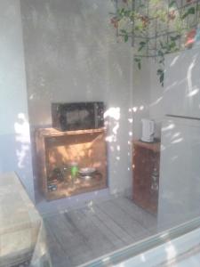 a kitchen with a fireplace in the corner of a room at Женский Hostel Dvor in Odesa