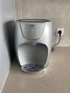 a coffee maker is sitting on the floor at Beauty apartment 3 rooms wi-fi in Netanya