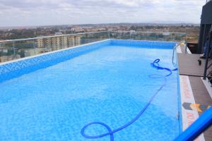 a large swimming pool on top of a building at CitiHeart Suite in Nairobi