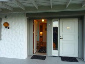 a front door of a house with a white door at Leilighet 1 og 2 - Mandal, Norges sørligste kommune in Ime