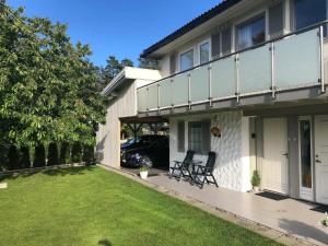 a house with a lawn in front of it at Leilighet 1 og 2 - Mandal, Norges sørligste kommune 