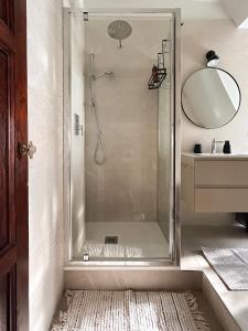 a shower with a glass door in a bathroom at Easy Isola, for an easy stay in Milan