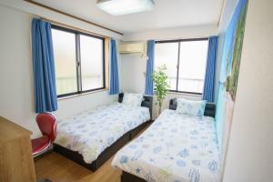 Postelja oz. postelje v sobi nastanitve BURan House