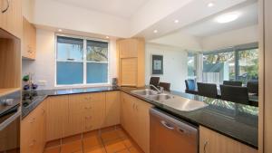 a kitchen with a sink and a counter top at Riverview Apartment 1 Block 1 in Iluka