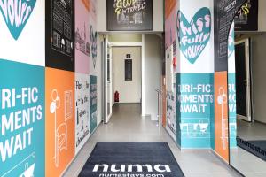 a hallway in a hospital with a rug on the floor at numa I Turi Apartments in Zürich