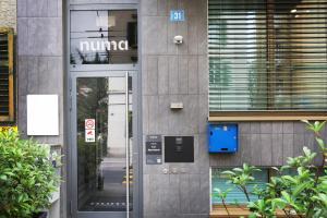 a entrance to a building with a glass door at numa I Turi Apartments in Zurich